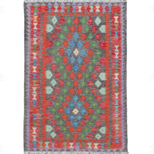 Introducing a remarkable handmade kilim that seamlessly blends the beauty of the natural world with traditional tribal designs. With a vibrant red base color that evokes the warmth of the earth, this kilim tells a story of nature's wonders and tribal heritage.